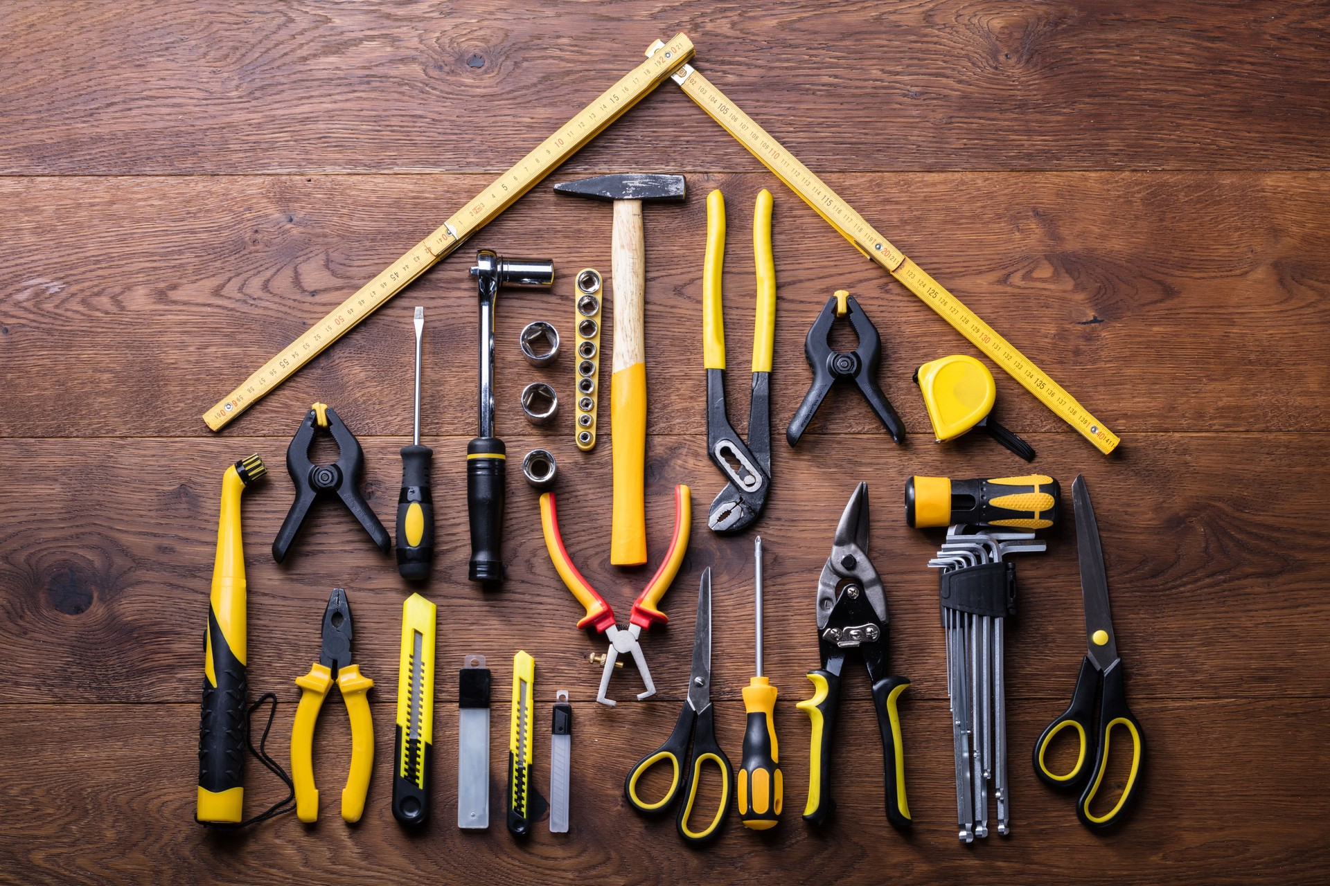 House Made Up Of Measuring Tapes And Tools